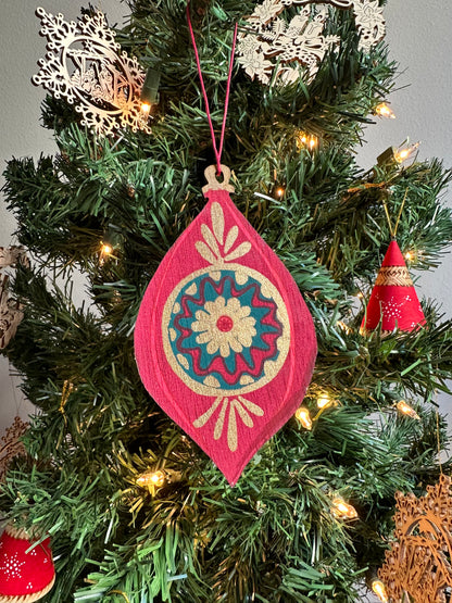 Wooden Bauble Ornament hanging on a Christmas tree.