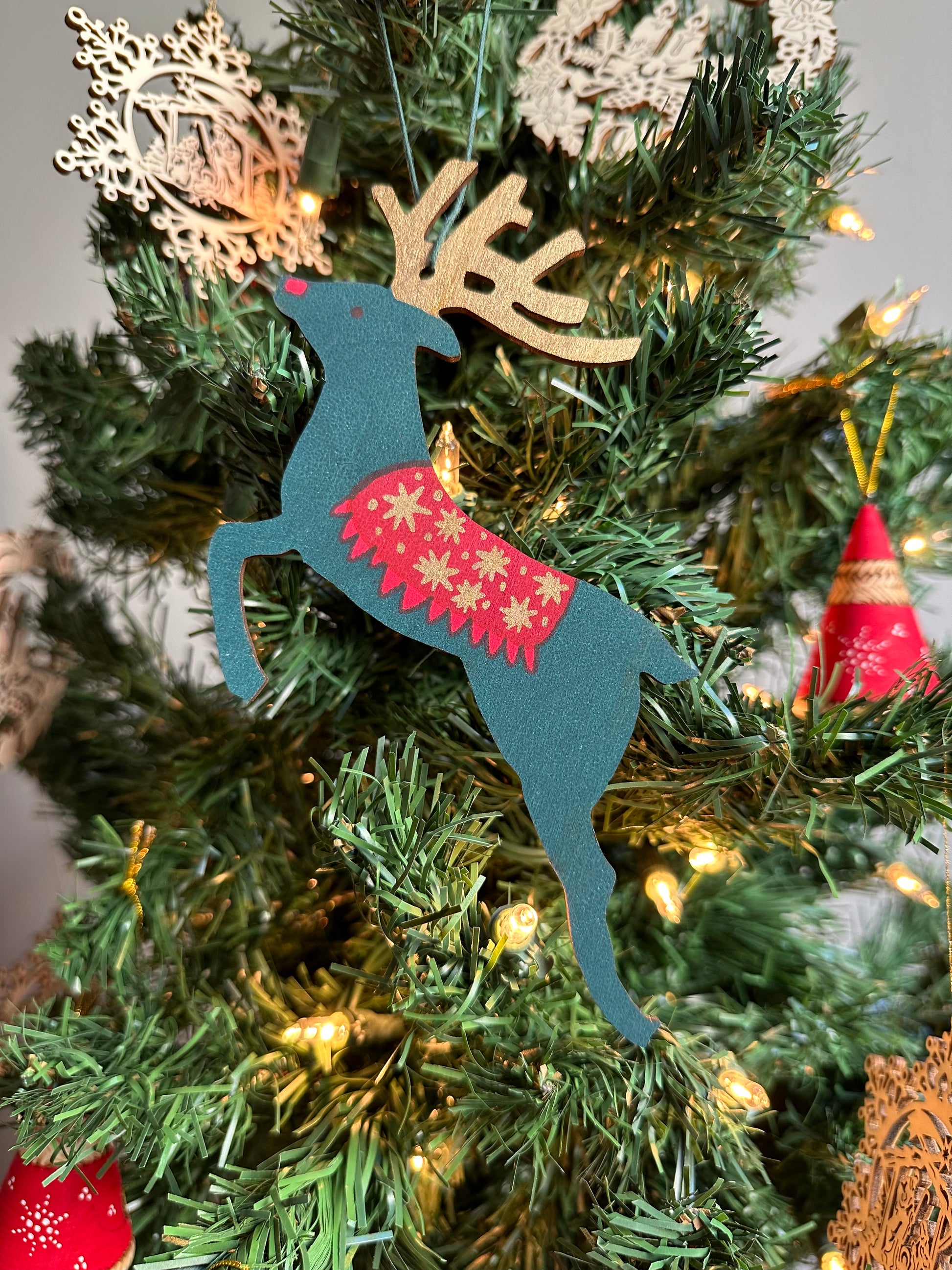 Wooden Reindeer Ornament, green and red design.