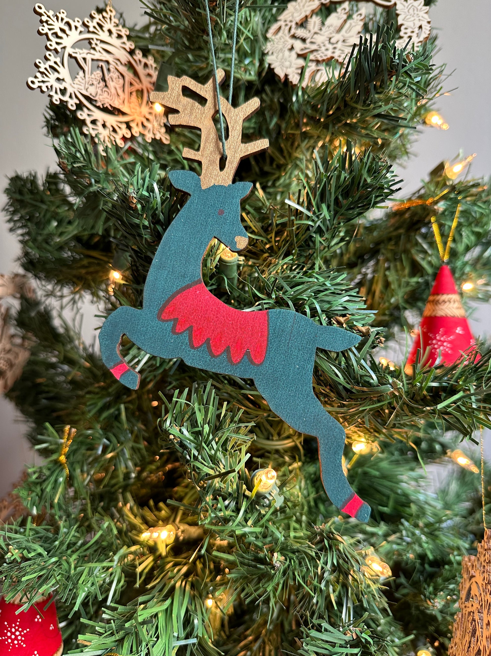 Wooden Reindeer Ornament, green and red design.