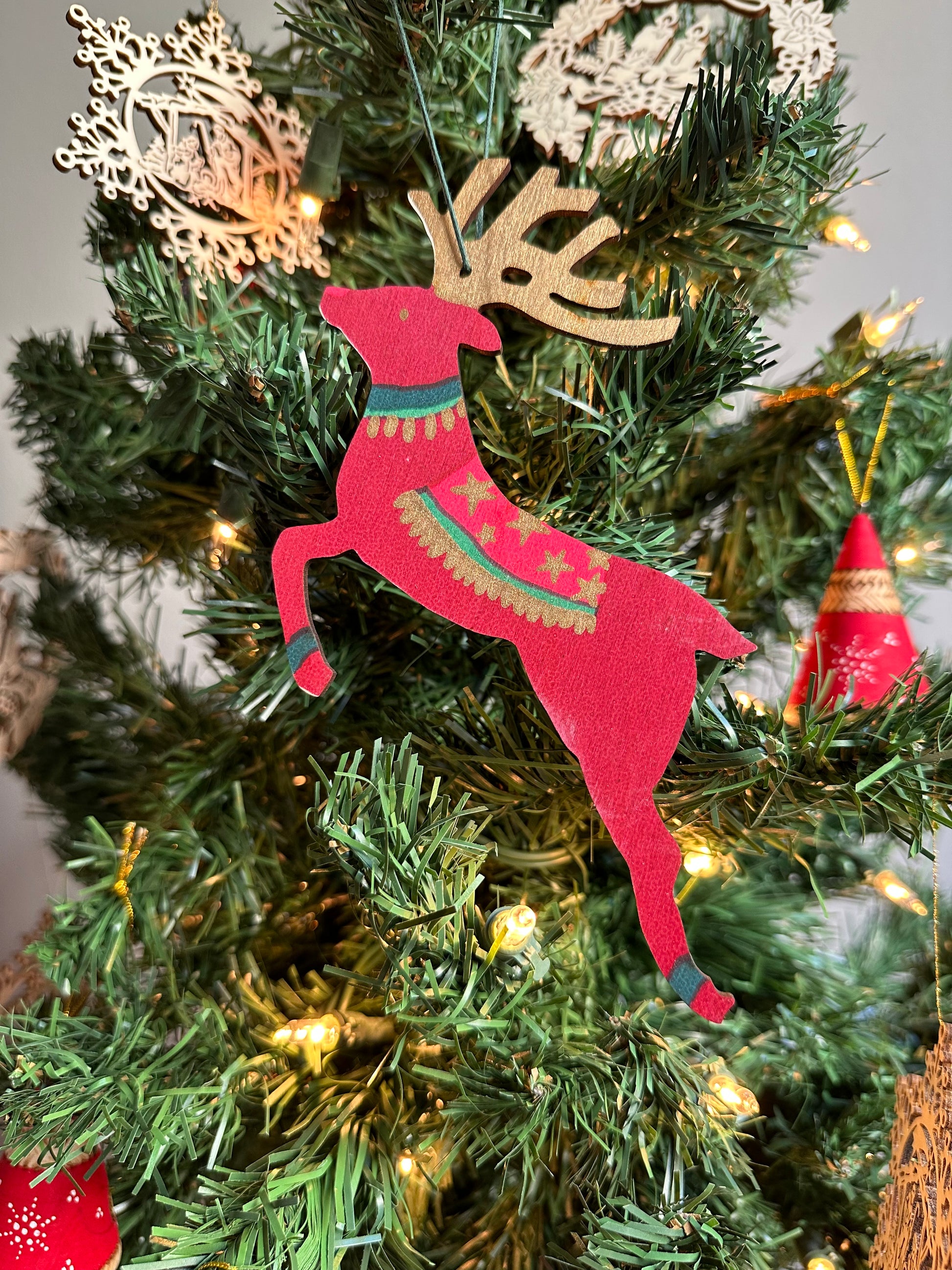 Wooden Reindeer Ornament, red and green design.