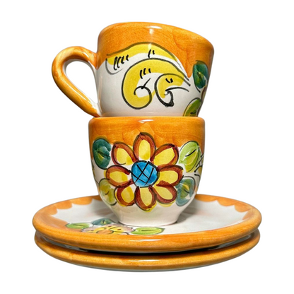 Set of 2 Italian espresso cups and saucers, featuring a yellow baroque flower design. Shown here stacked.