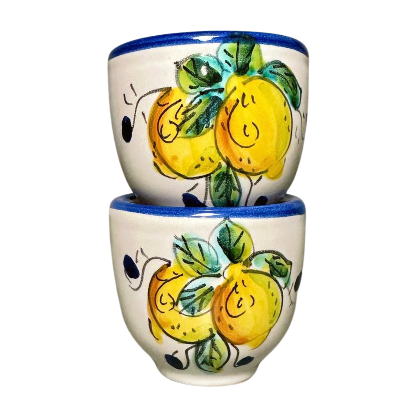 Italian espresso cups featuring a yellow lemon design with a blue rim and handle. Stacked on top of one another.