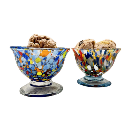 Murano glass ice cream dishes, pictured here in both color options - classic blue and multicolor - with scoops of ice cream in each. Imported from Italy.
