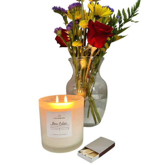 Casa Horatio's Coconut Wax Candle_Maui Bliss with match box and flowers.